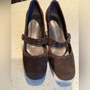 Naturalizer brown suede shoes with stylish strap and button.